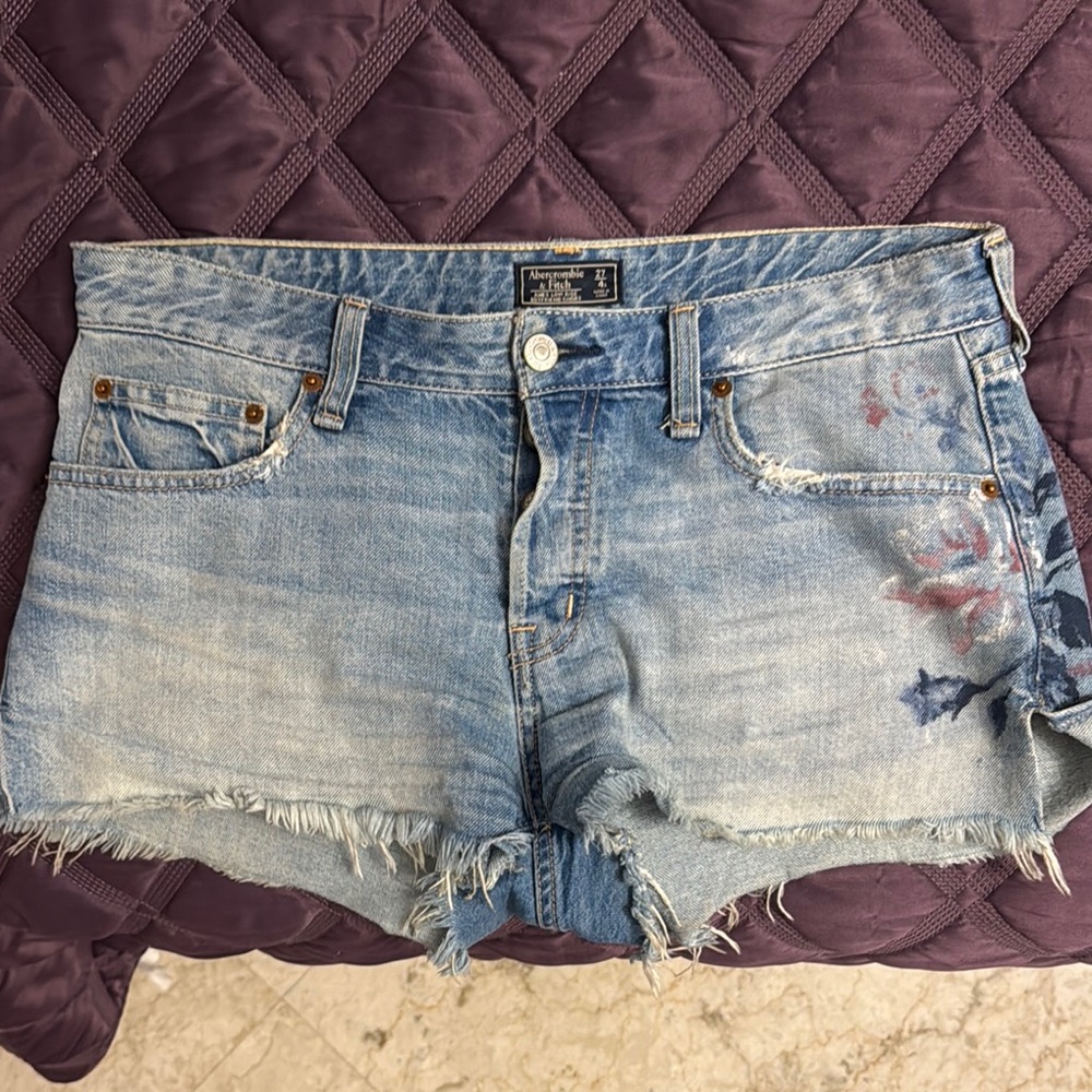 Blue Jean Shorts with Distressed Details and Raw Hem